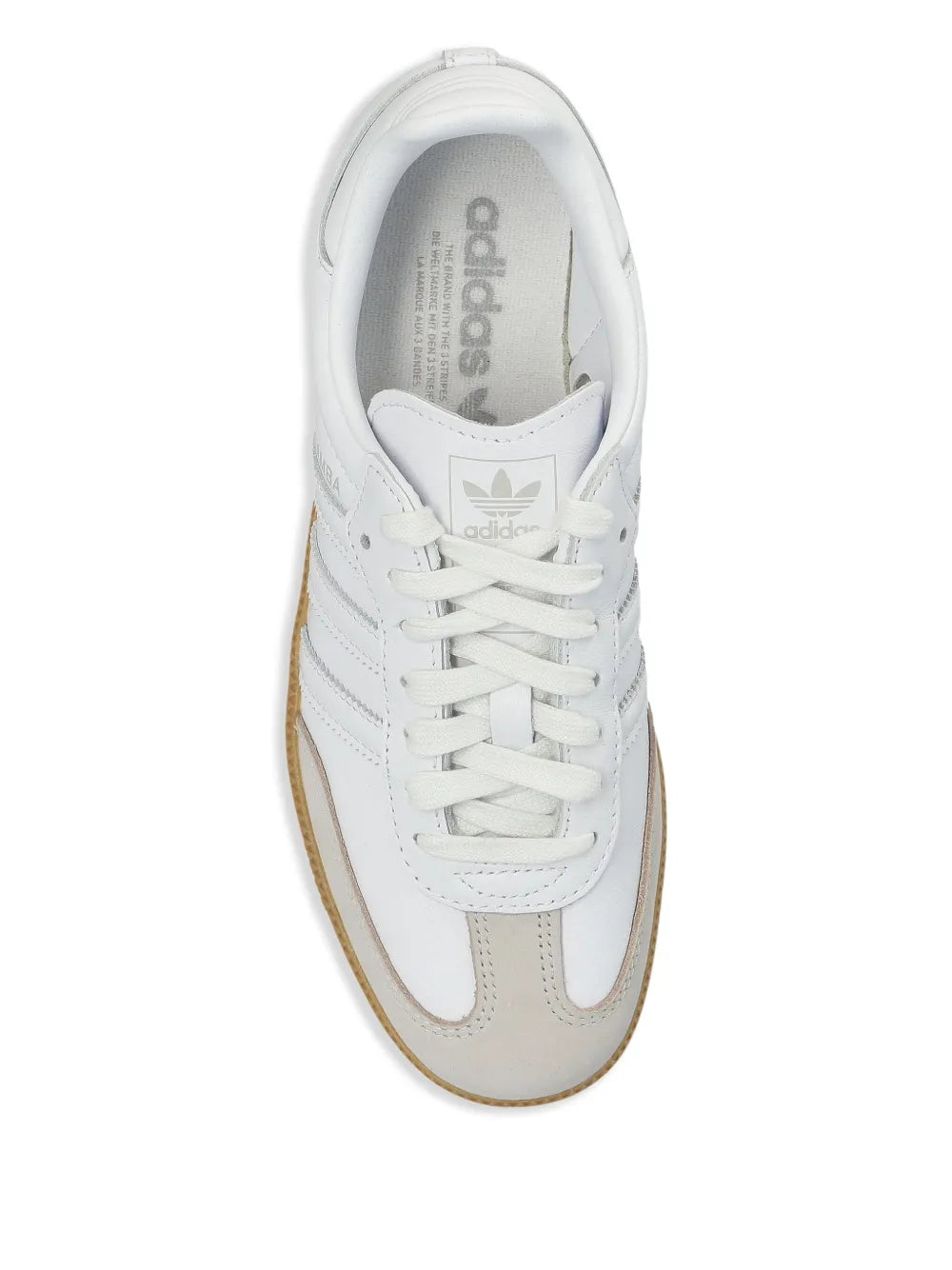 White adidas sneaker interior view with lace-up front and cushioned collar
