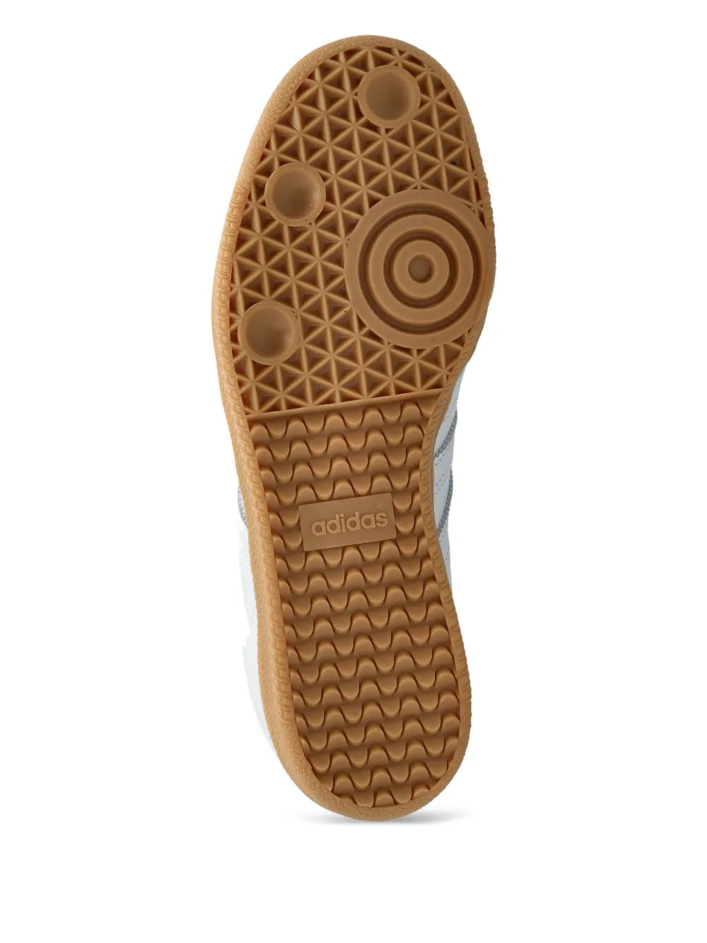 Gum rubber outsole with circular traction pattern and adidas logo