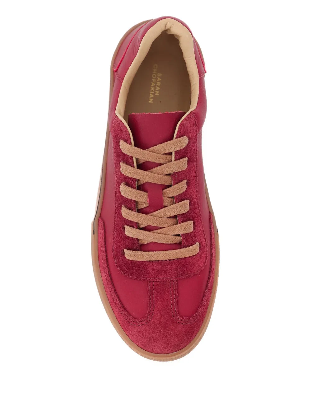Red lace-up sneaker with beige lining and tan rubber sole, front view