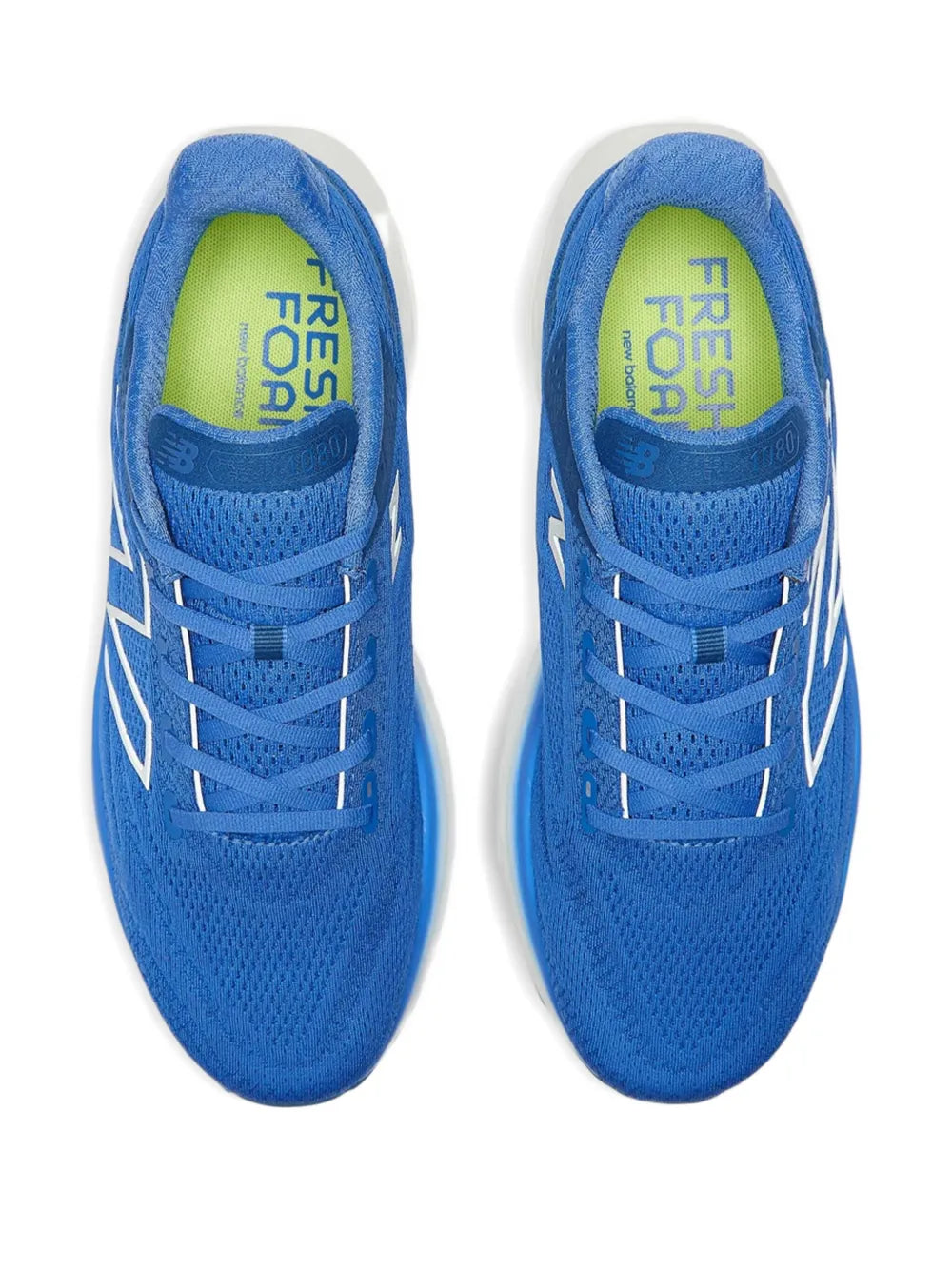 Blue knit sneakers with lace-up front and green printed inner tongue