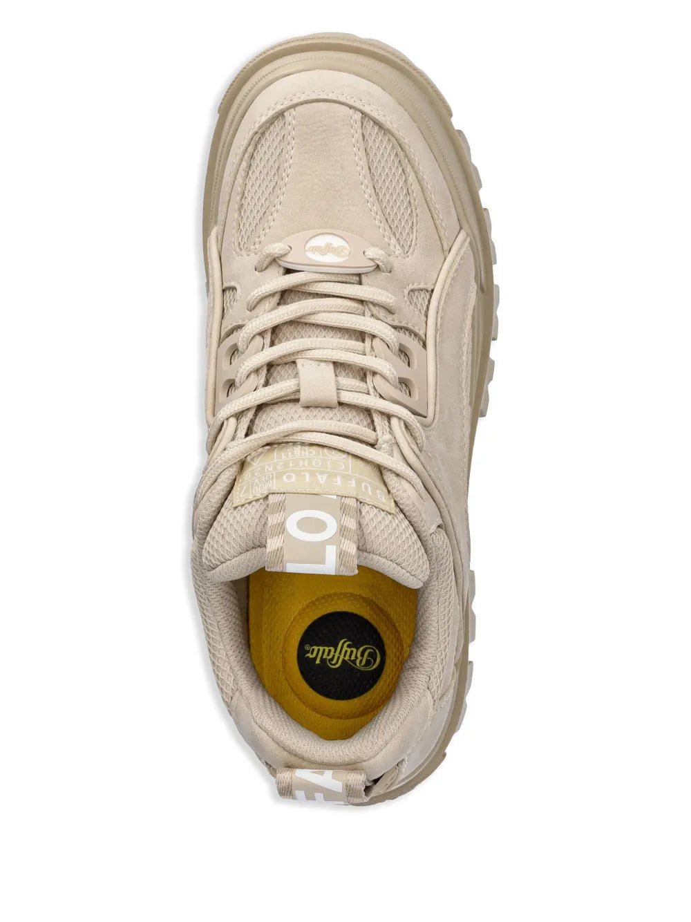 Beige sneaker showing interior yellow lining and lace-up tongue logo patch