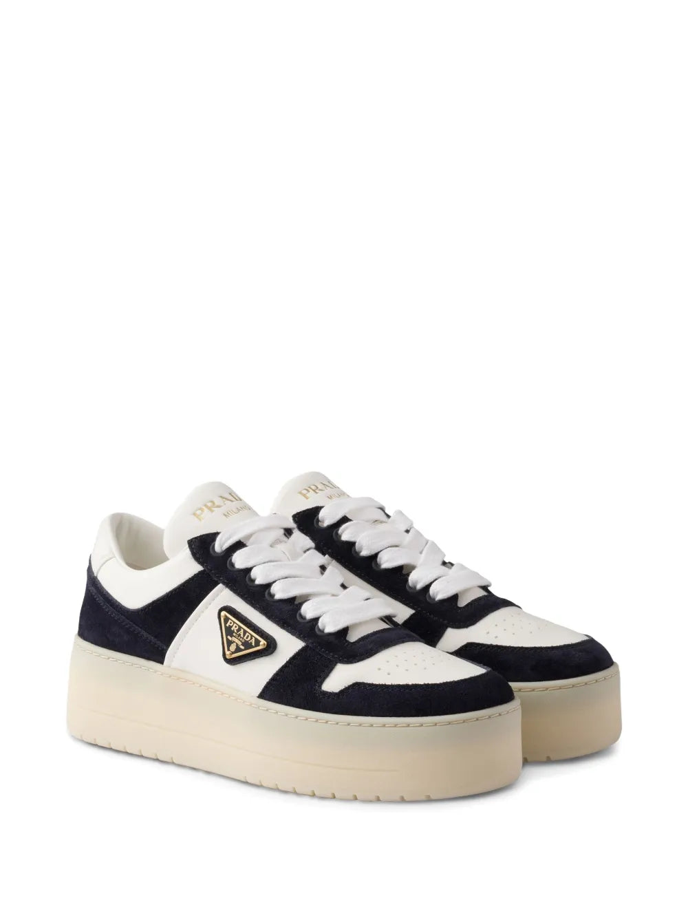 Navy and white lace-up platform sneakers with triangular logo emblem on side