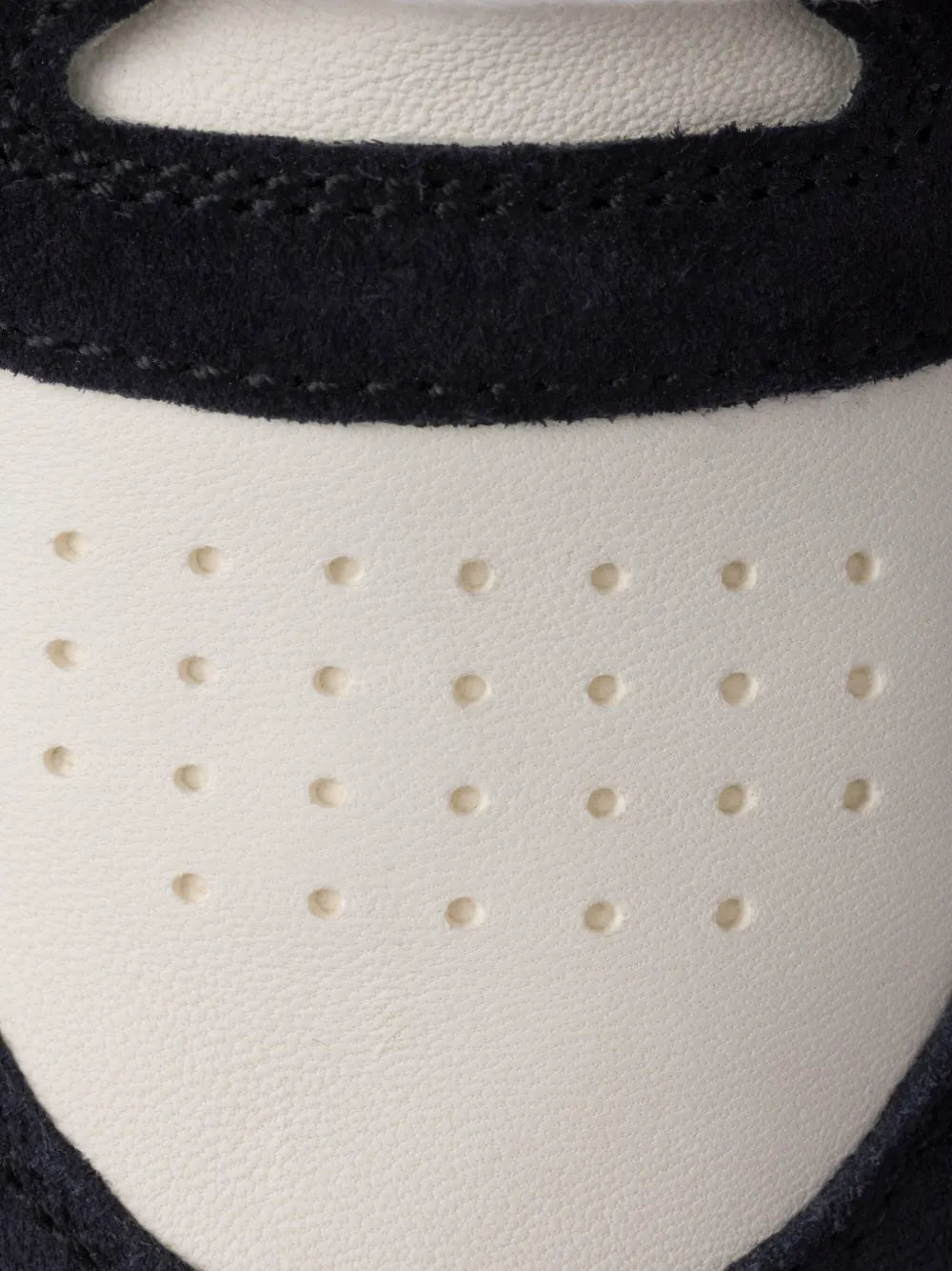 White leather toe panel with perforations and navy suede trim