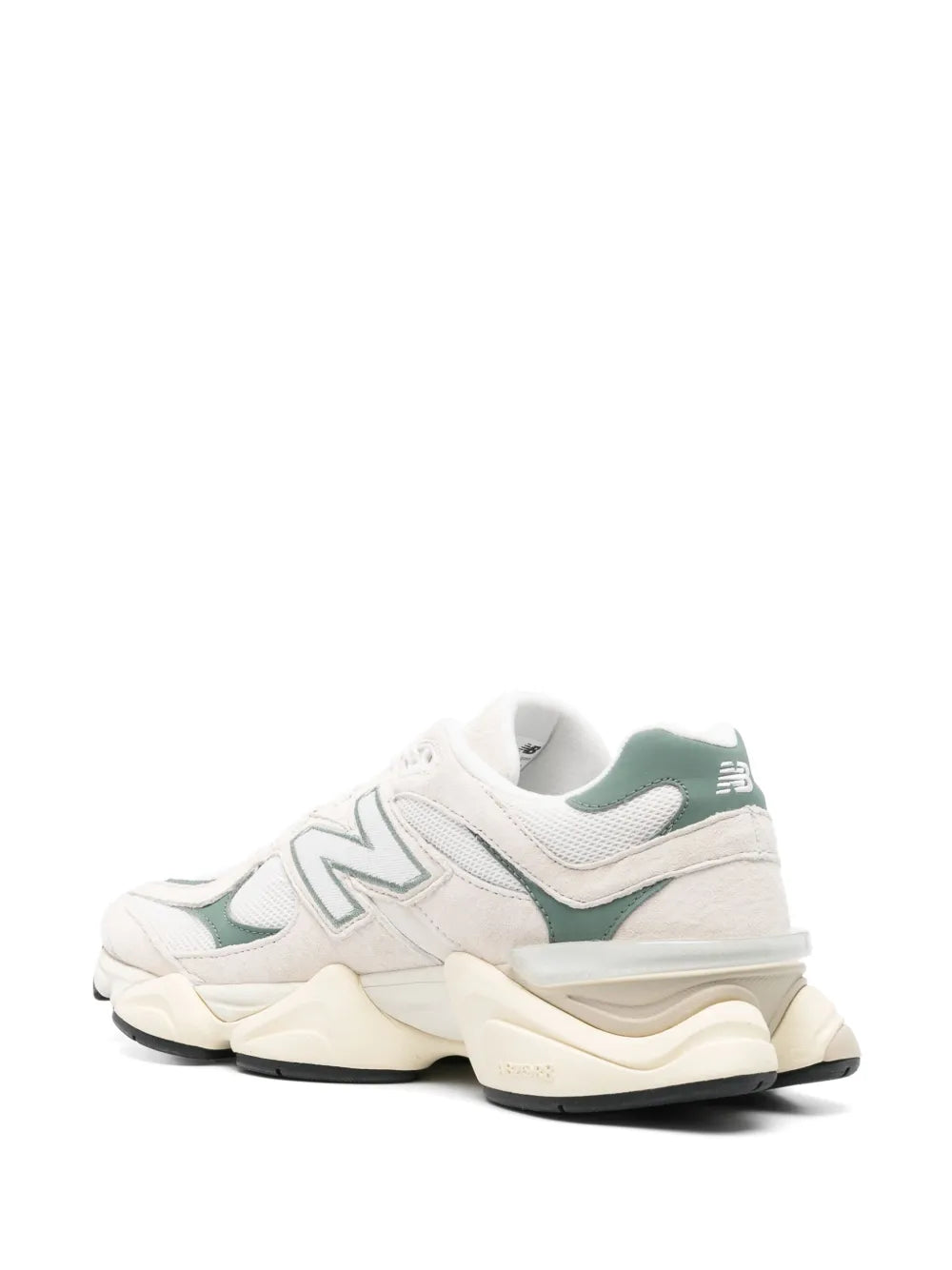 Light grey New Balance 9060 sneakers, heel and side profile with green branding and thick sole.
