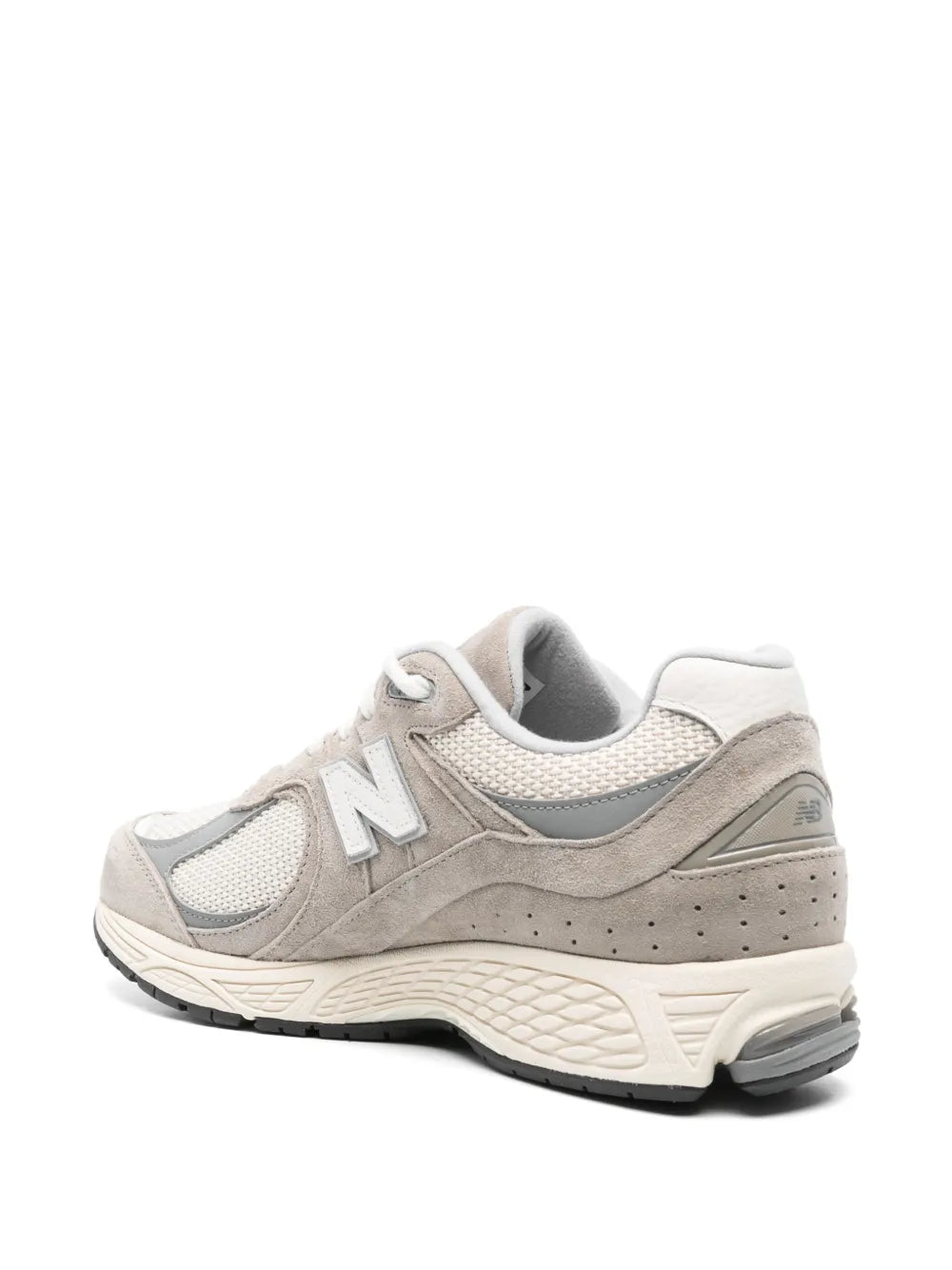 Beige New Balance 2002R running-style sneaker with textured panels, N logo, and heel tab