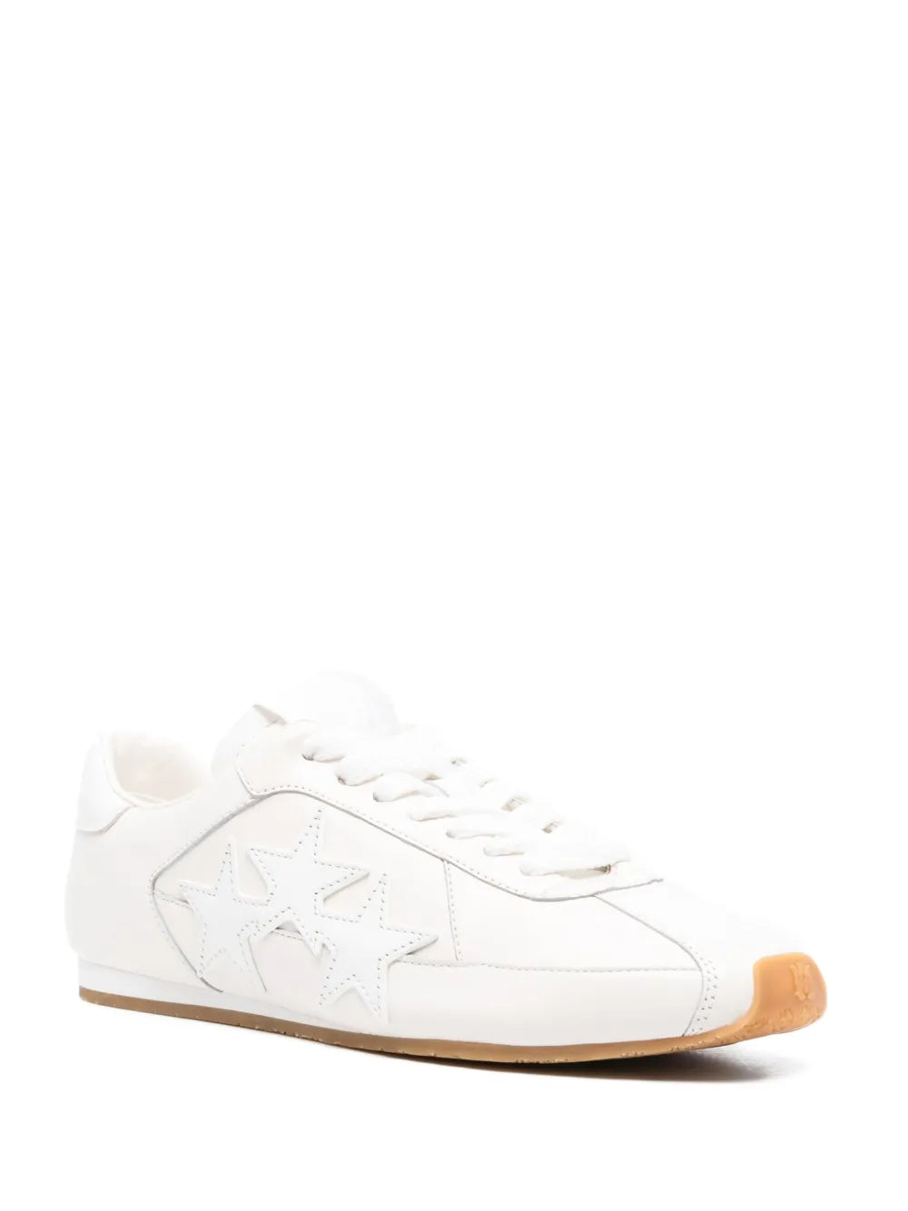 White low-top sneaker, side star design, lace-up front, gum rubber sole