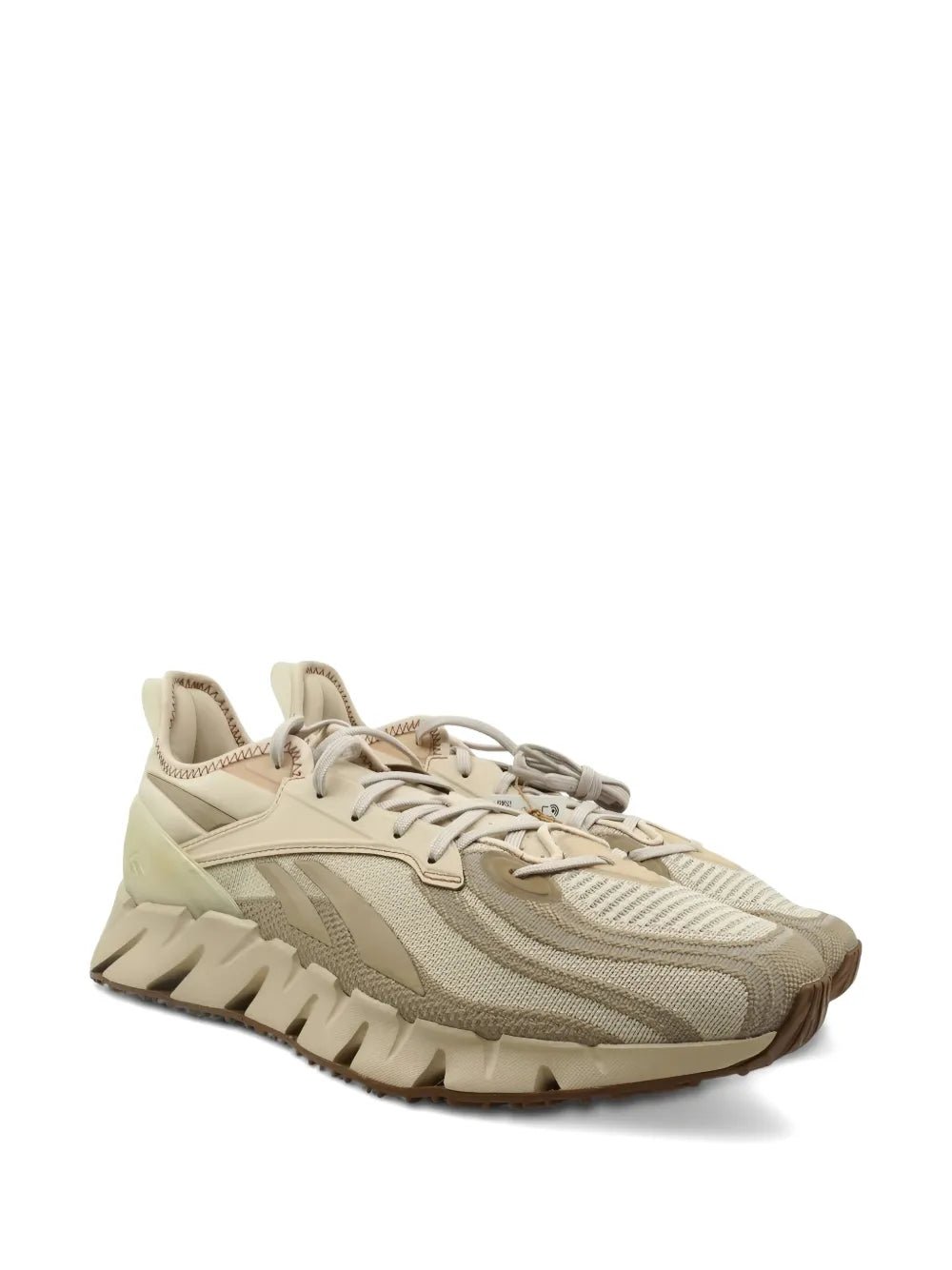 Beige low-top running sneakers, side view, mesh upper with lace-up closure