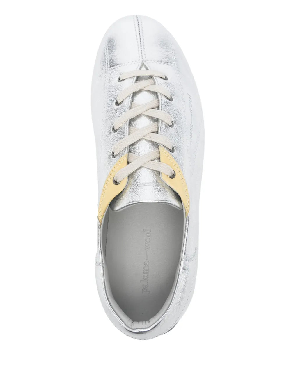 Metallic silver sneaker with lace-up front and yellow accent on tongue
