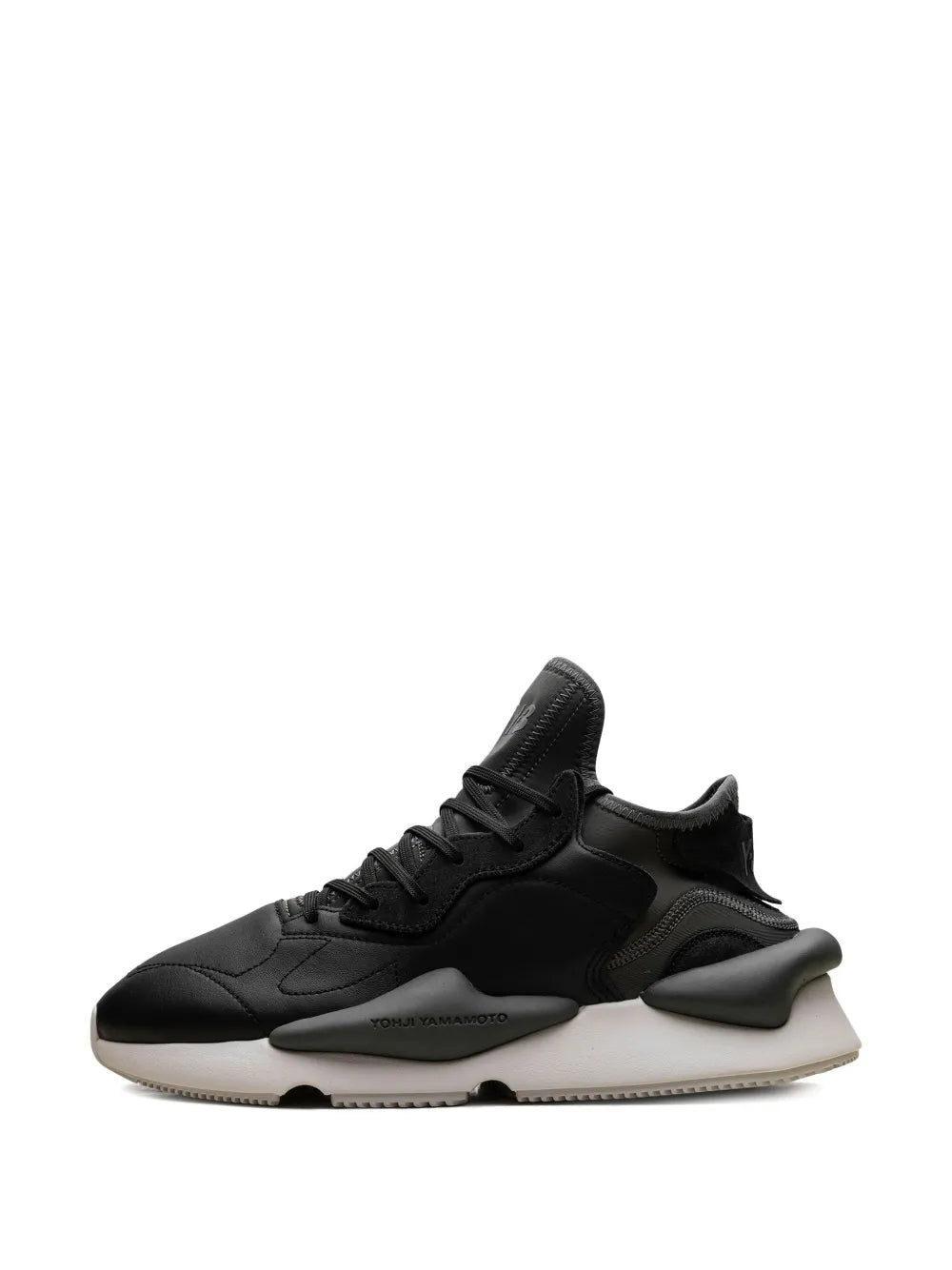 Black lace-up sneaker with layered straps, sculpted heel and light rubber sole