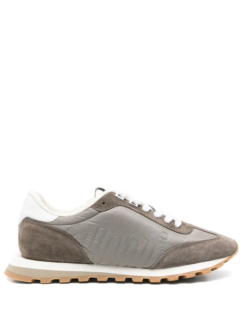 Ash grey and off-white low-top sneakers with white laces and gum rubber sole