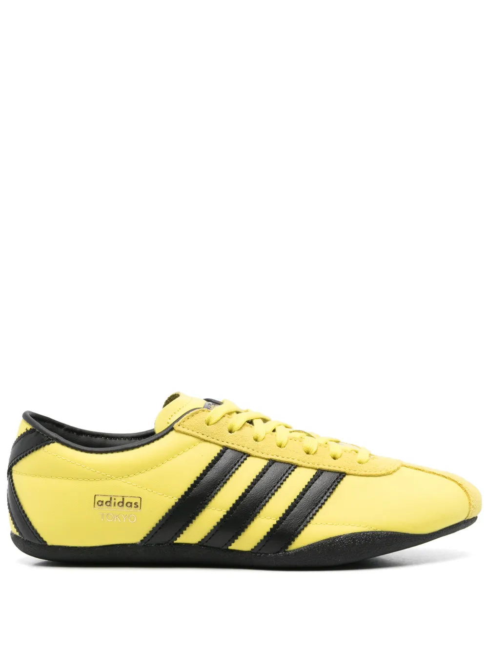 Yellow adidas Tokyo sneaker with three black stripes and lace-up front