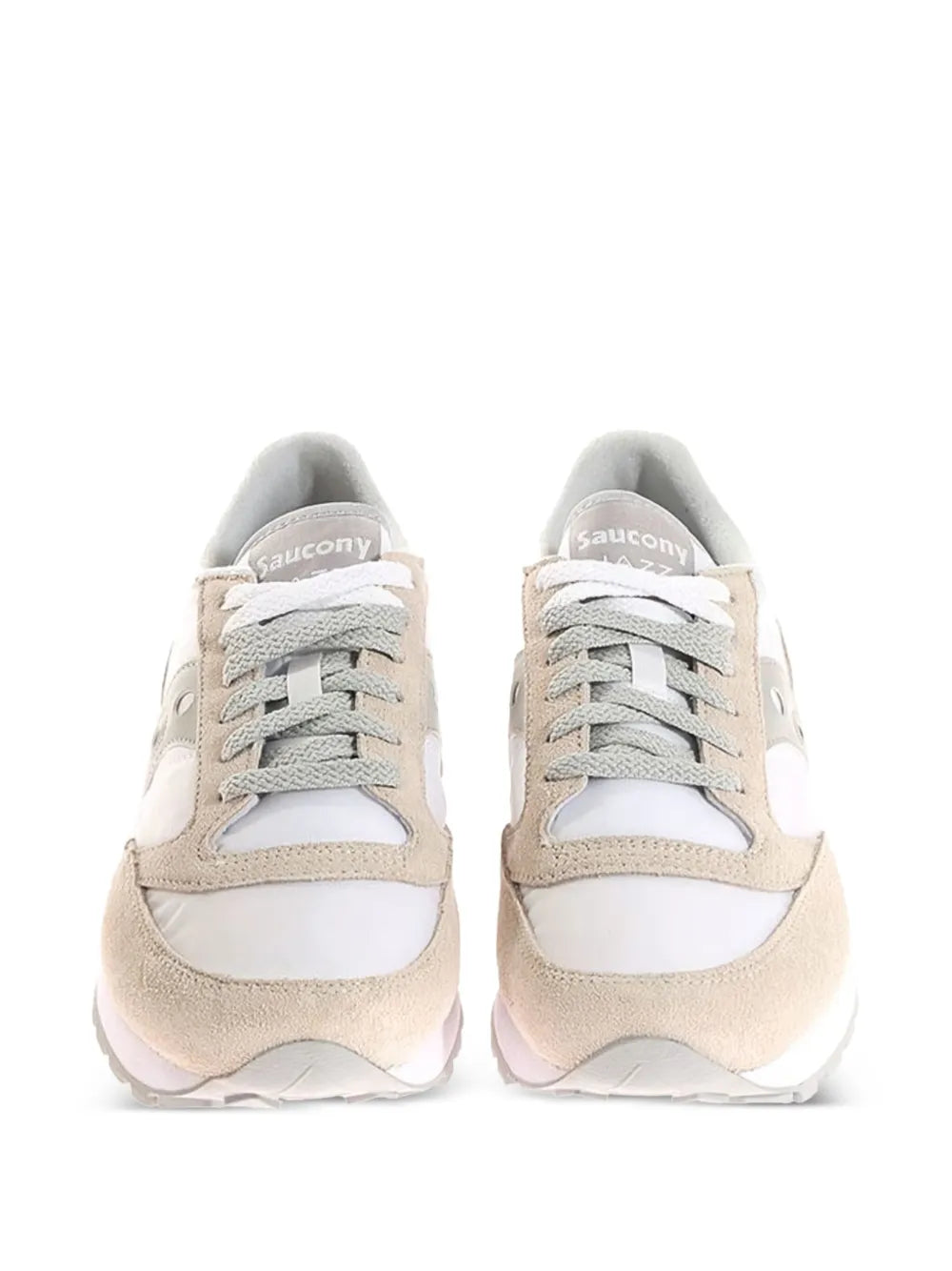 Pair of white and beige low-top sneakers with gray laces and cushioned collar