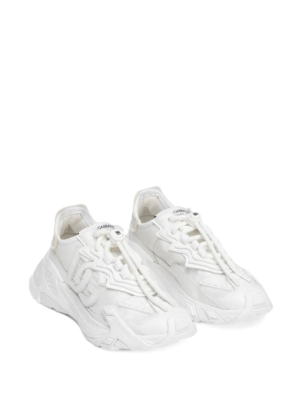 White lace-up sneakers, angled view of chunky outsole and textured panels