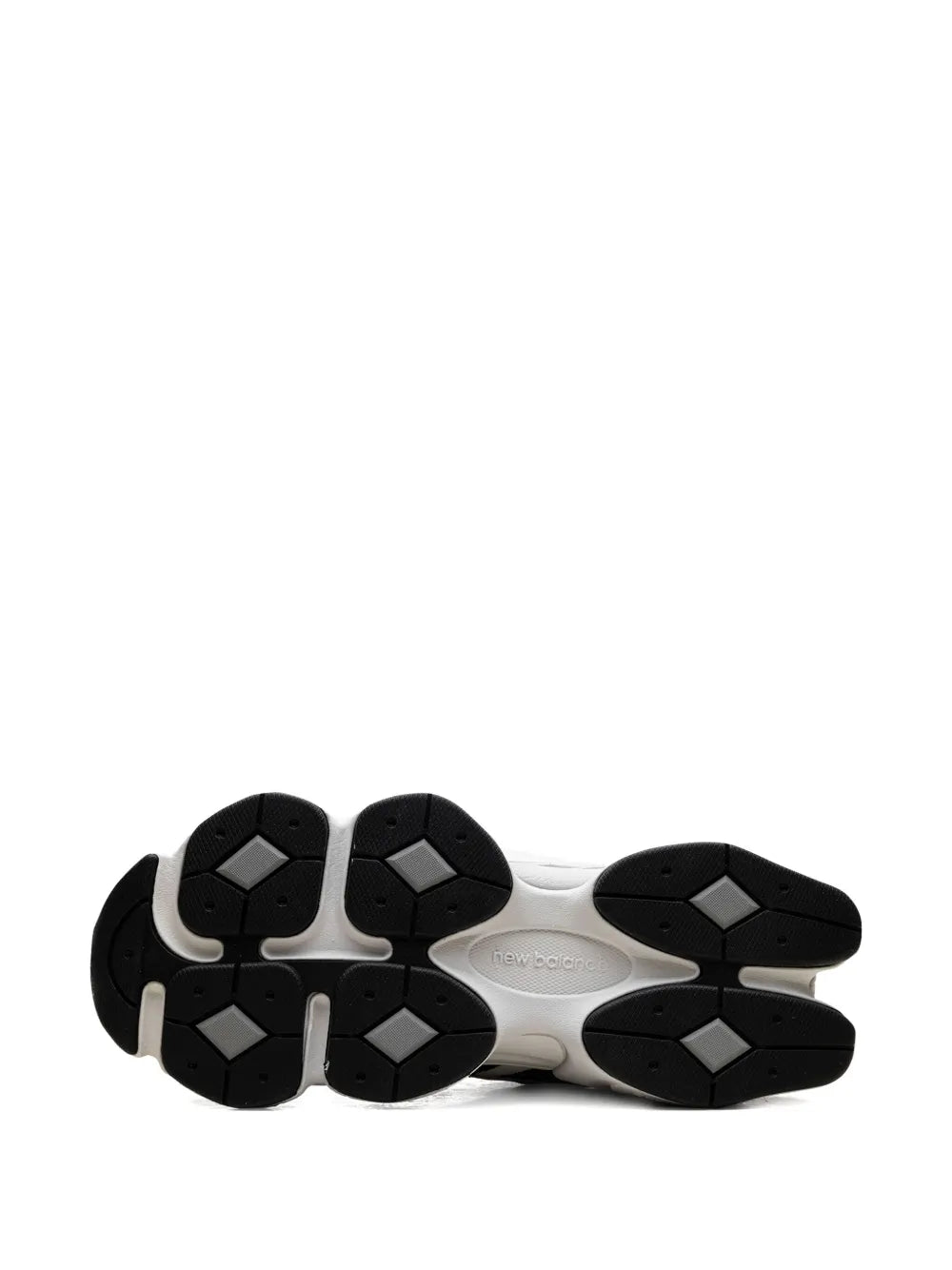 Black and white rubber outsole with hex traction lugs