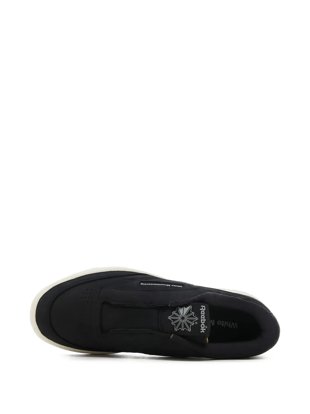 Black low-top sneakers with rubber outsole and heel branding