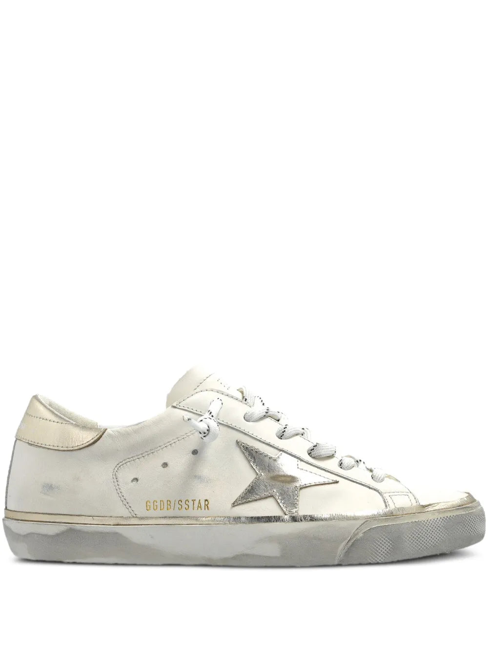 Beige leather sneakers with metallic star logo and lace-up front