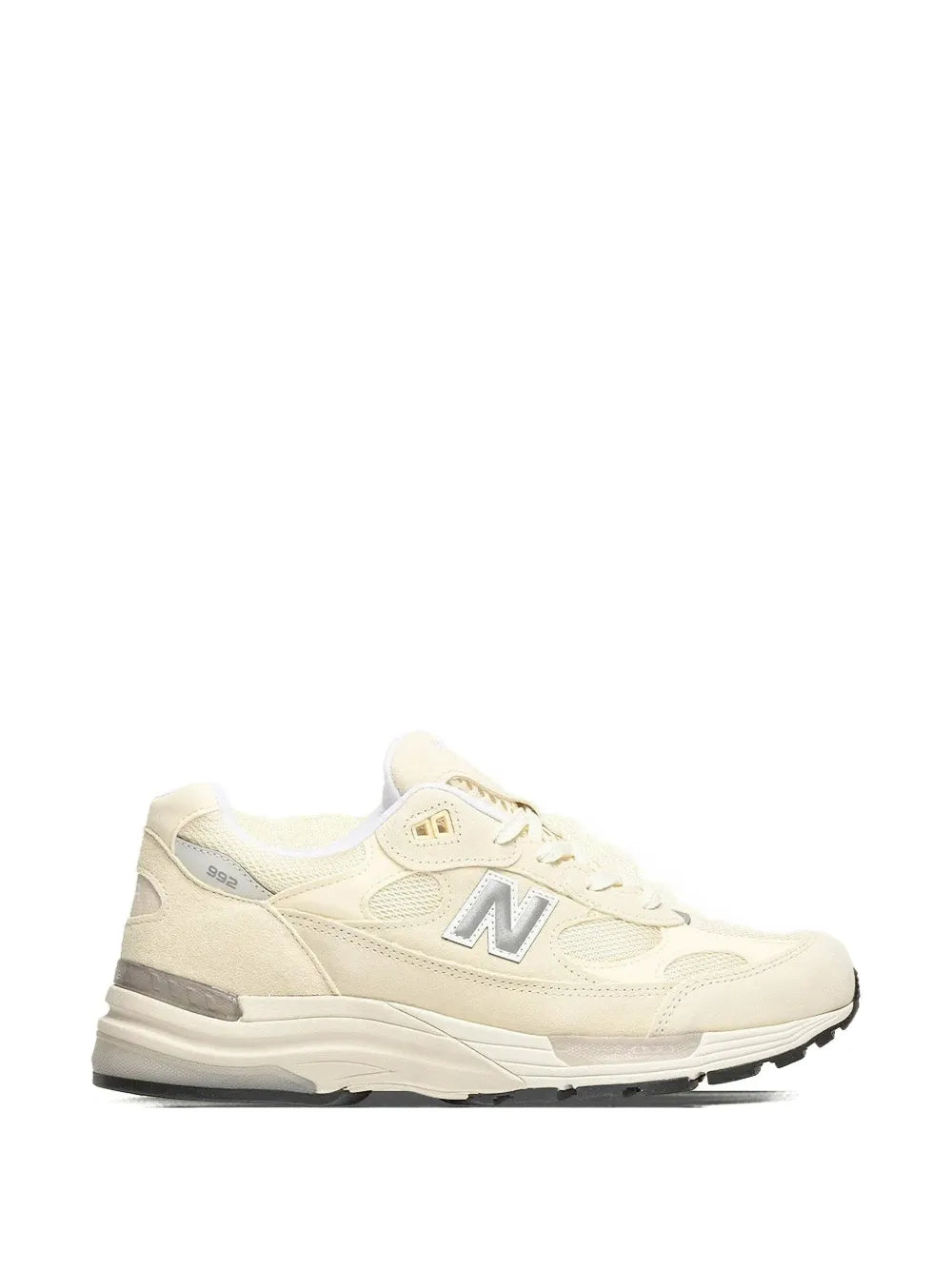 Off-white running sneakers with lace-up front and N logo