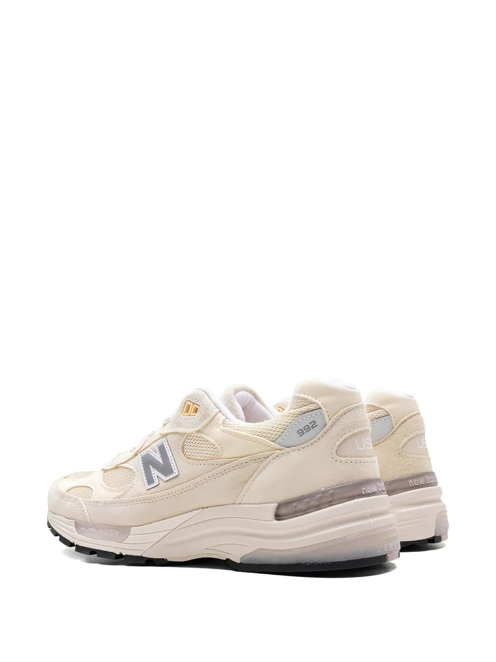 Off-white running sneakers, rear/side view with N logo and USA text