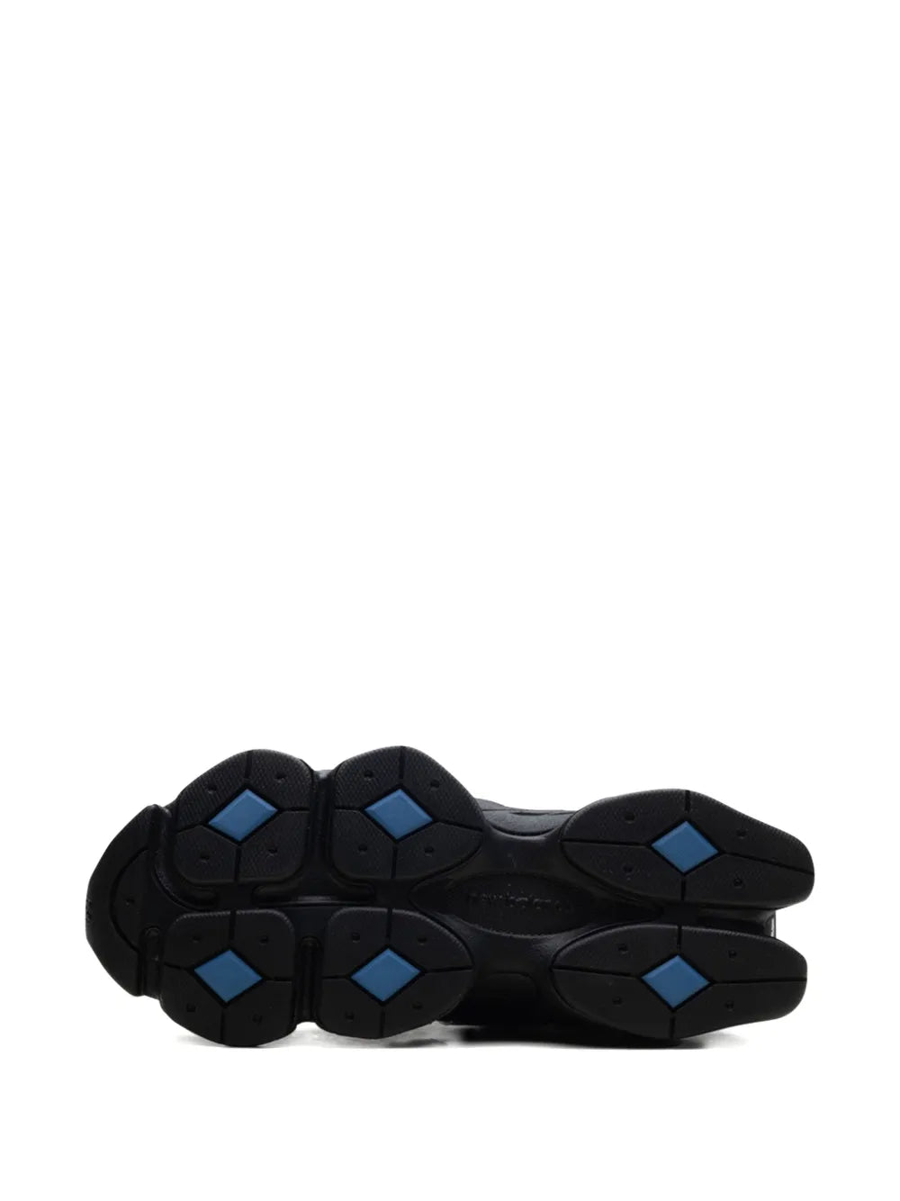 New Balance 9060 outsole tread view, black rubber with blue hex traction accents