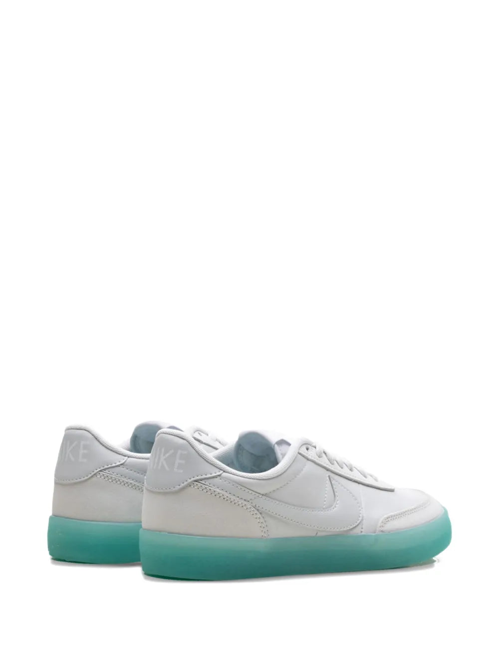 Pair of white low-top sneakers with teal outsole and swoosh logo