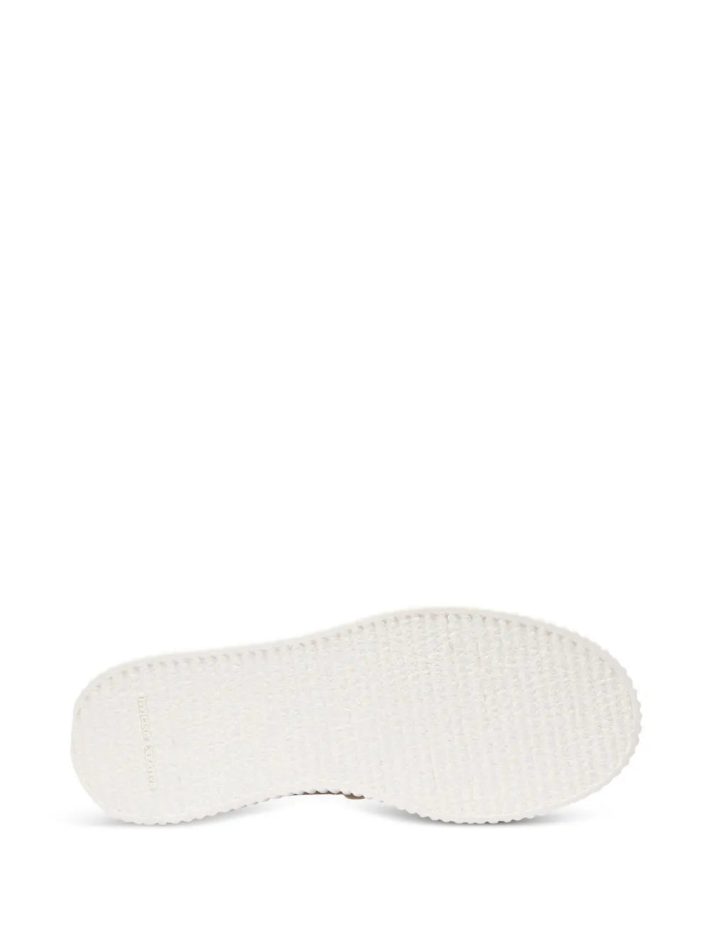 Beige sneaker outsole with textured tread for grip