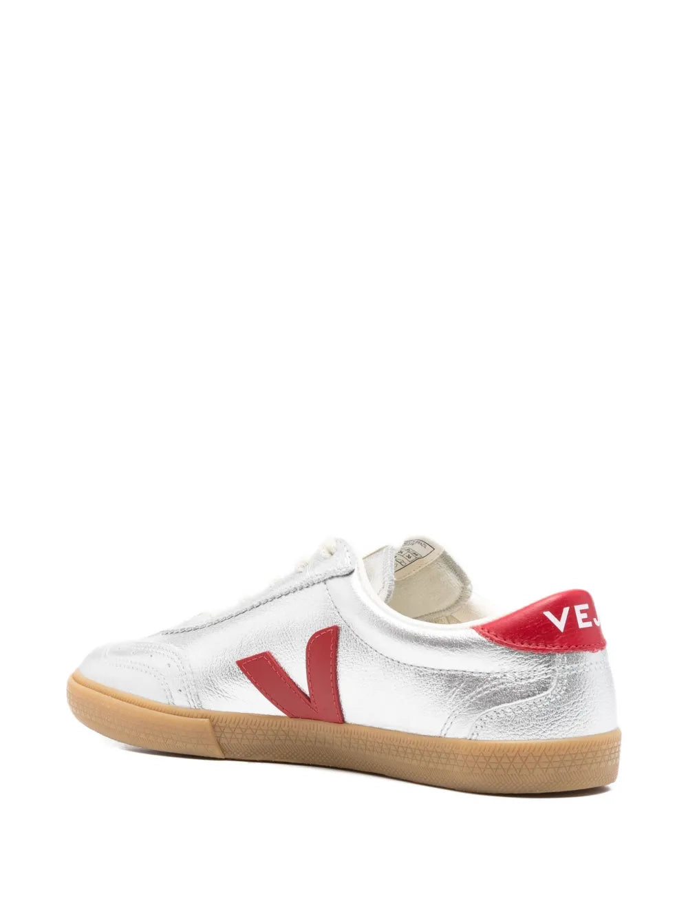 White low-top sneakers with red heel tab and red V side logo, gum sole