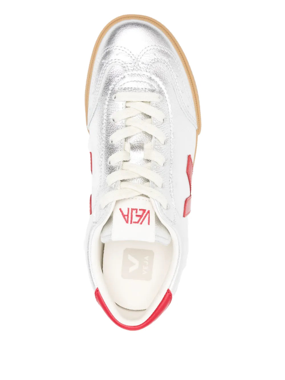 White lace-up sneakers, top view with red details and gum outsole