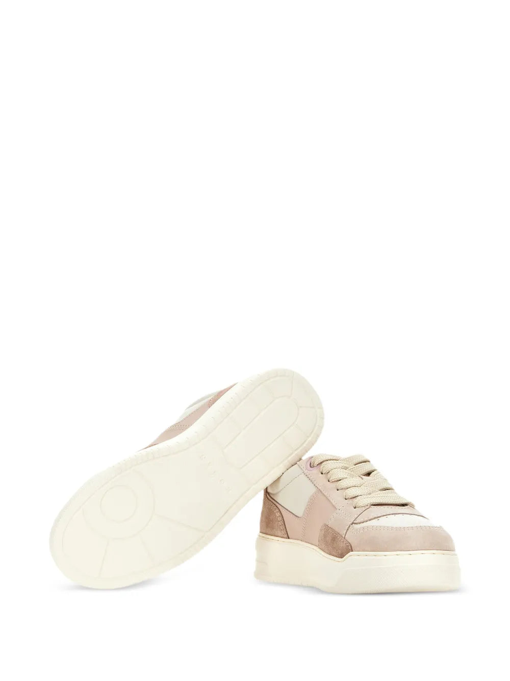 Low-top sneakers with visible outsole and lace-up upper in pink and tan colorblocks