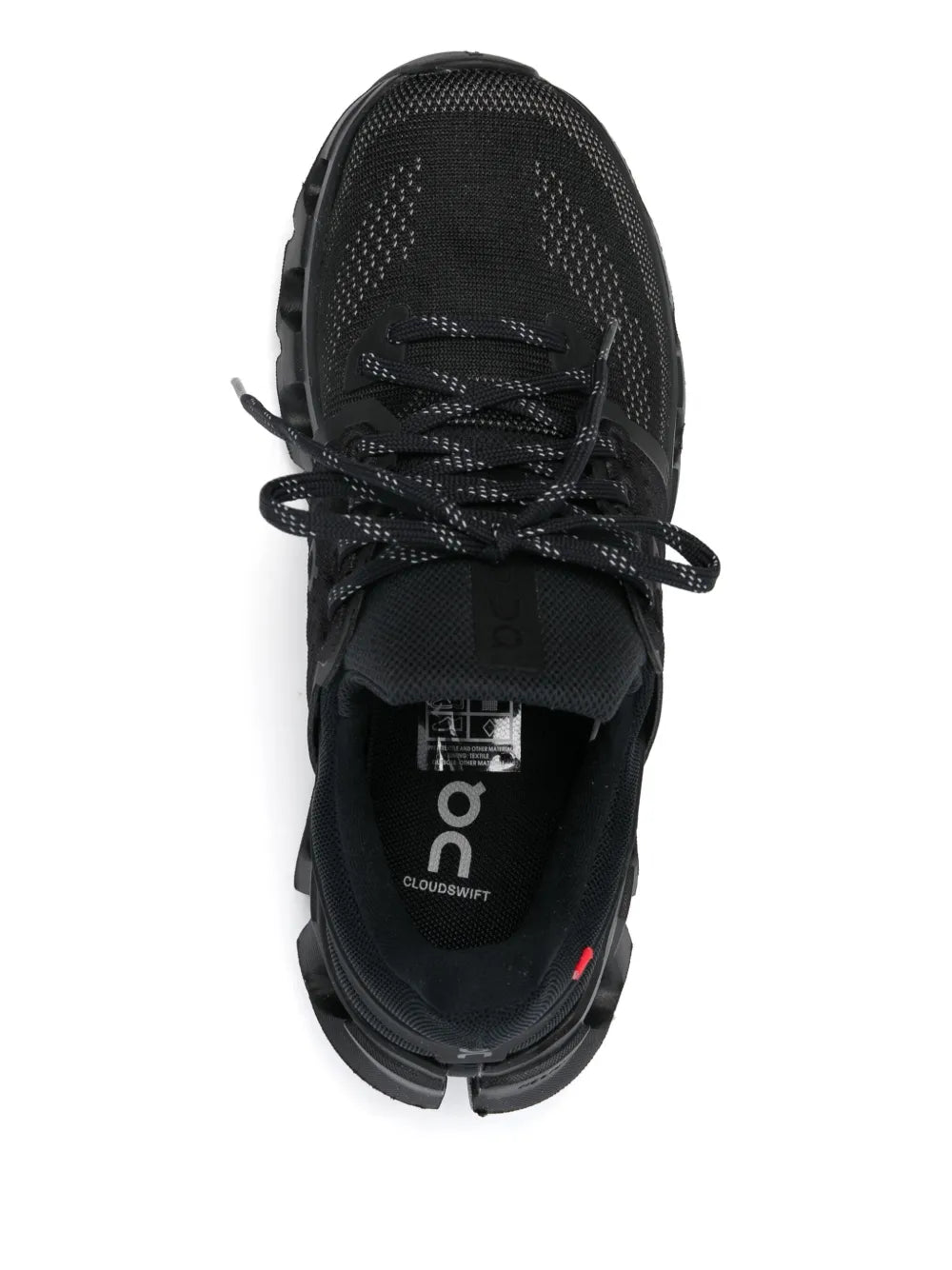 Black lace-up running shoe with mesh upper, tongue label, and rubber outsole