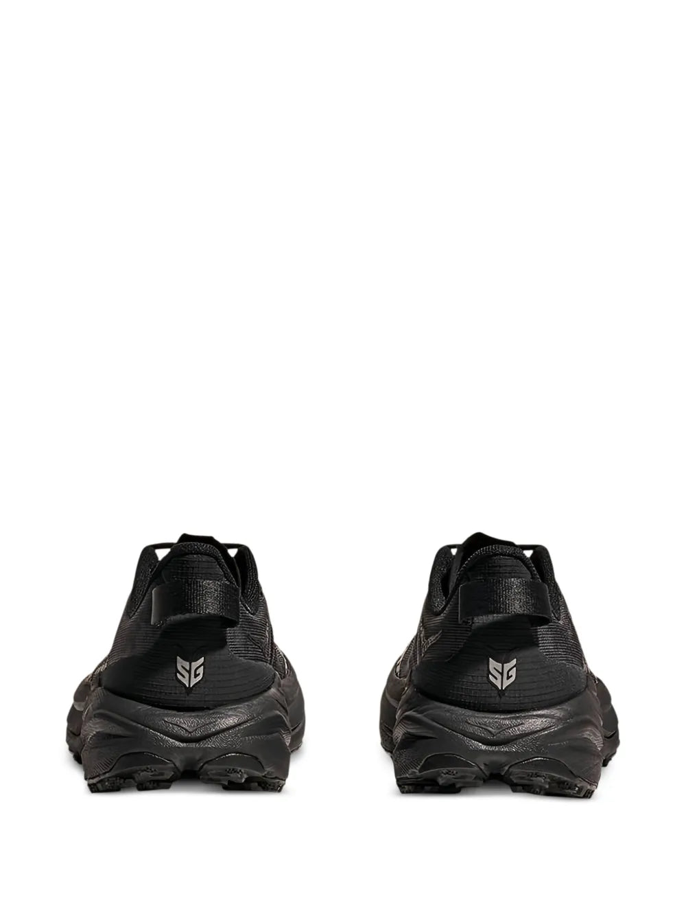 Black Hoka trail sneaker heel view with pull tab and rugged outsole tread