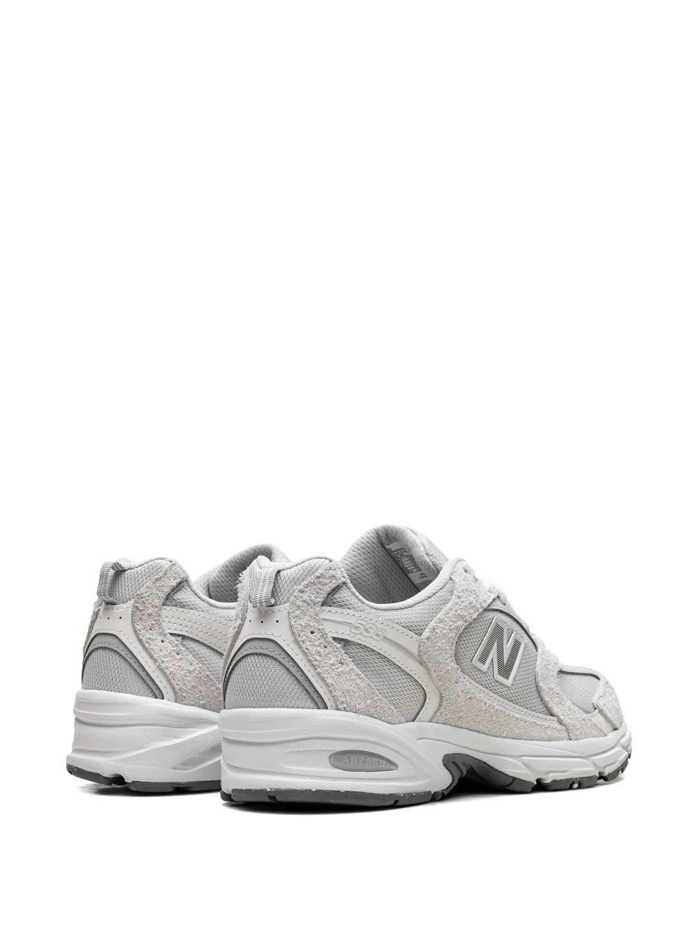 New Balance 530 light grey sneakers, back and side view with heel pull tab