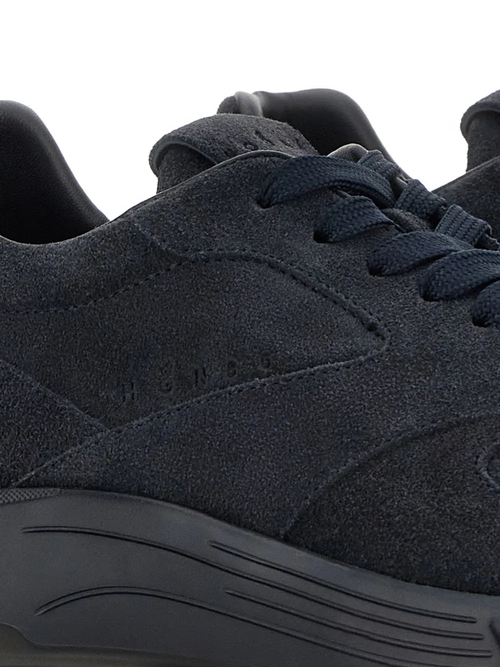 Hogan Hyperlight sneaker upper close-up, dark blue suede and lace eyelets