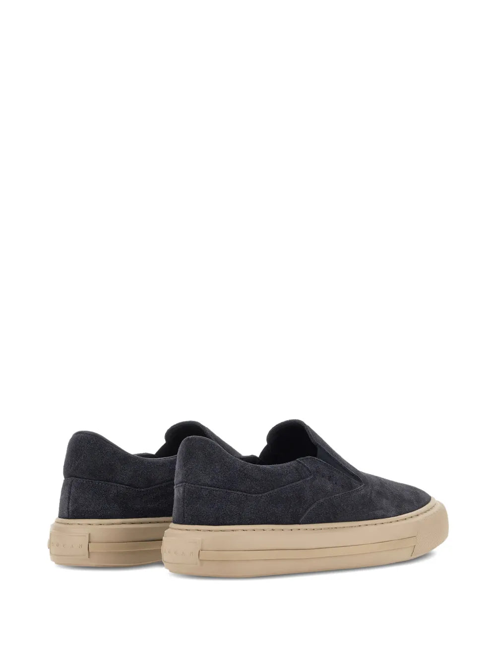 Pair of dark navy suede slip-on sneakers with beige trim and rubber sole