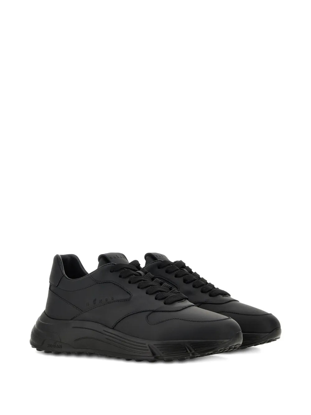 Black low-top sneakers with lace-up front and cushioned, ridged sole