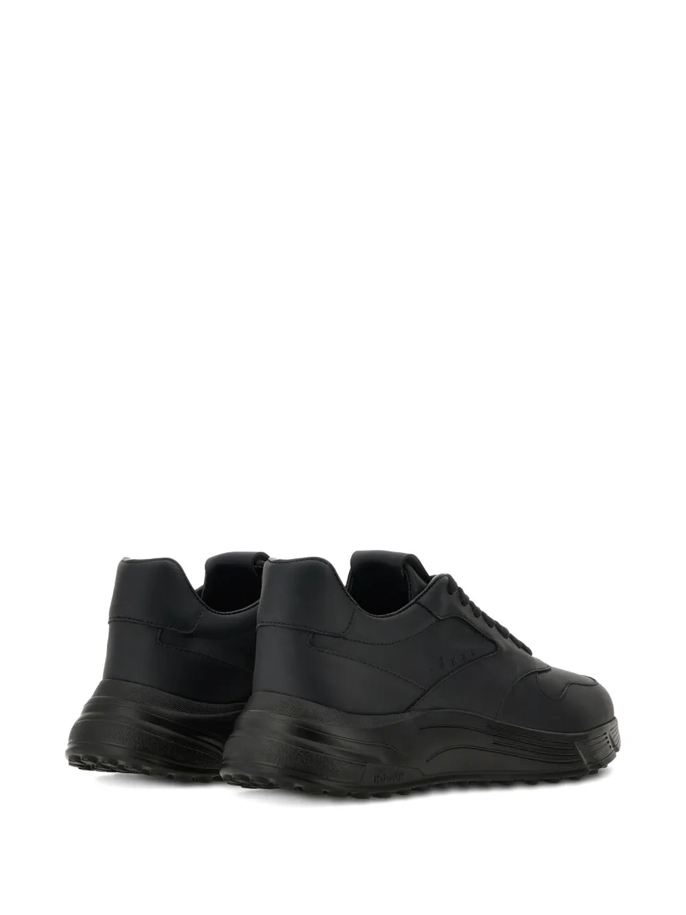 Black low-top sneakers rear view, lace-up with padded collar