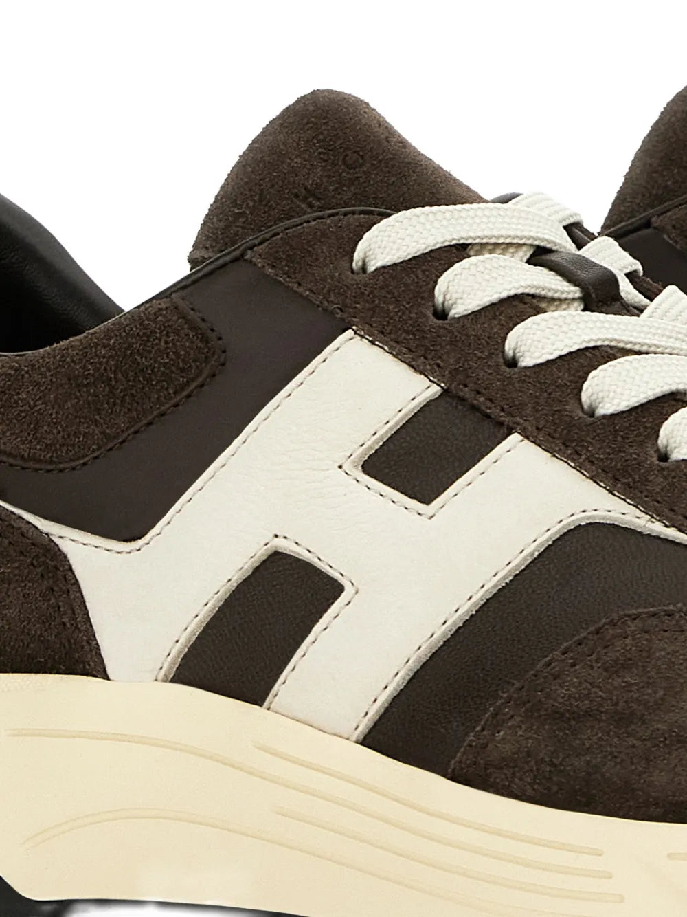 Coffee brown suede and white leather-look panels on lace-up sneaker