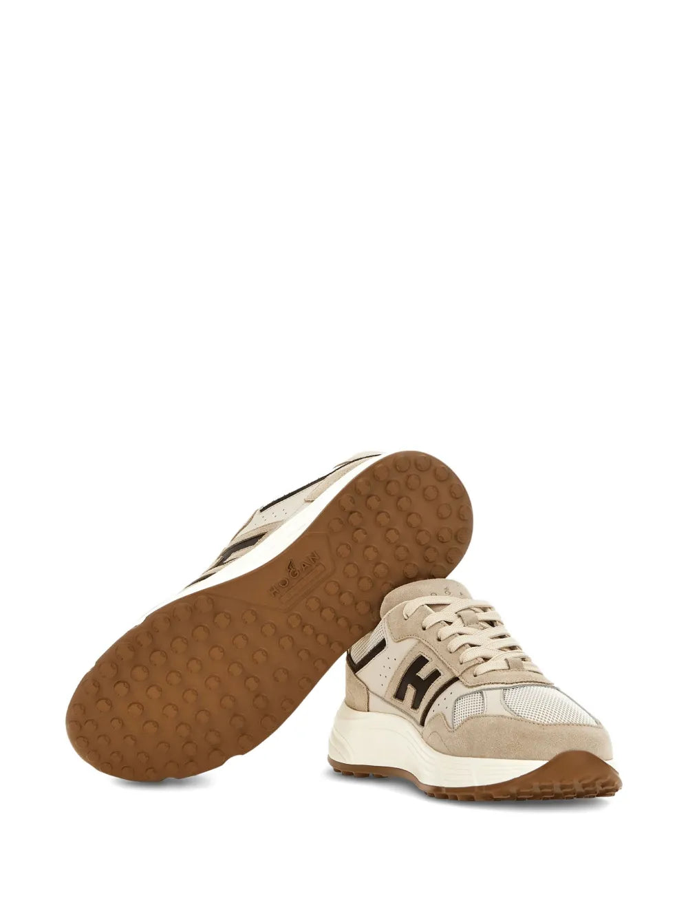 Light beige sneakers with textured rubber outsole and lace-up upper