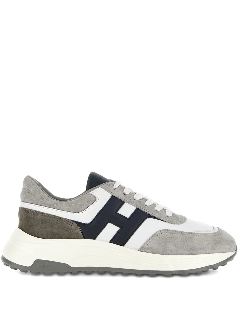 Low-top lace-up sneakers in white, gray, and navy with chunky rubber sole