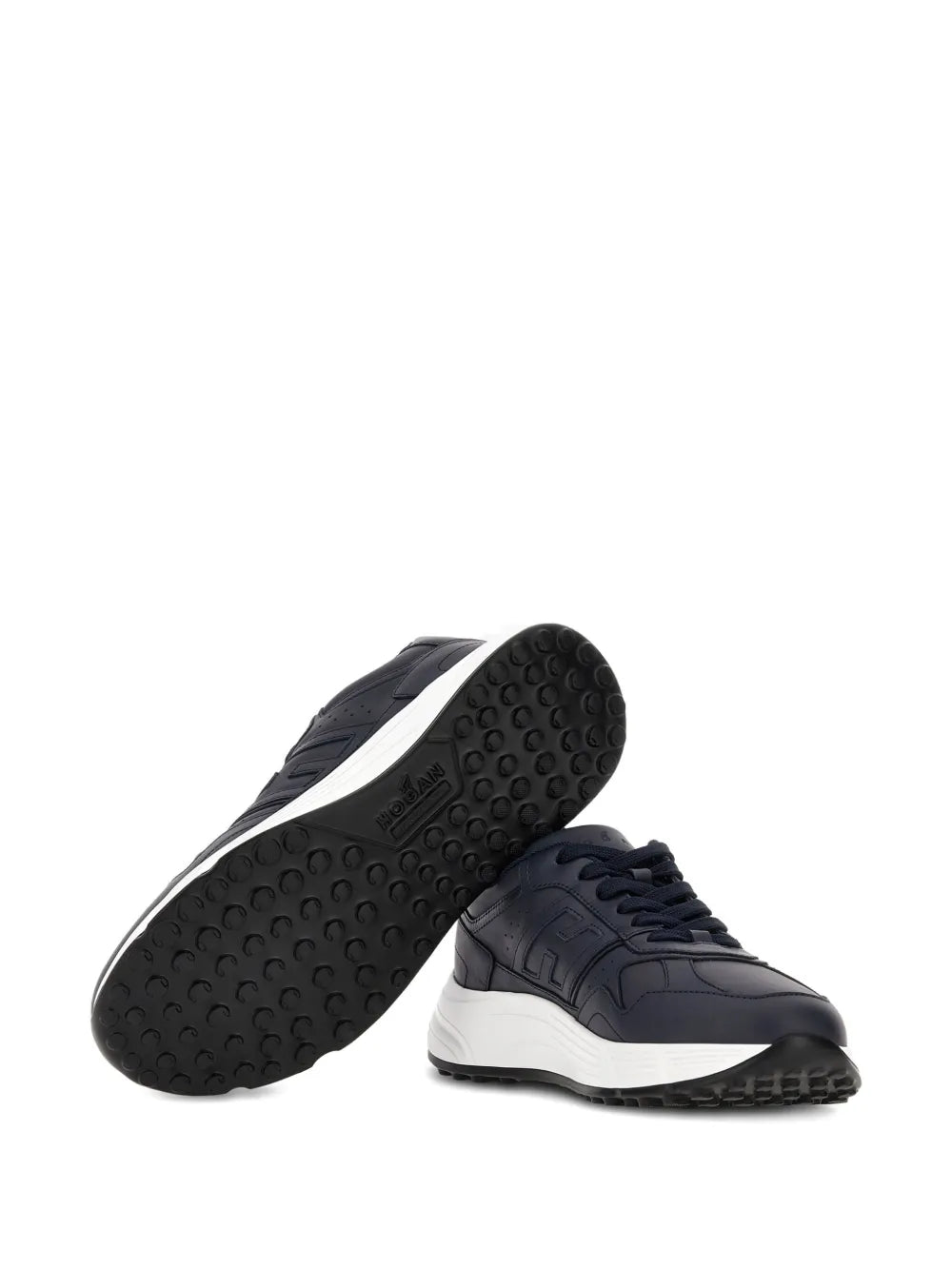 Dark blue sneakers with textured rubber outsole and white midsole