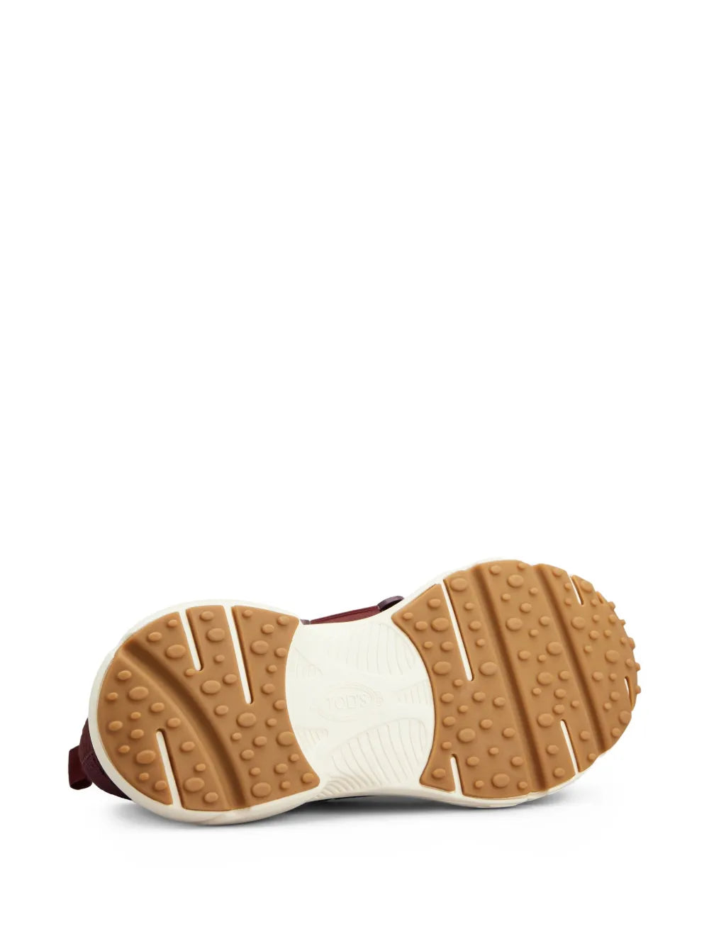 Outsole view of burgundy slip-on sneaker with grippy rubber tread
