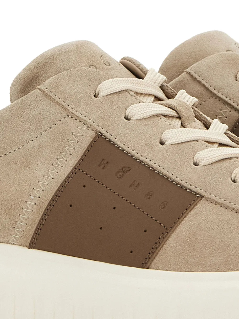 Close-up of almond beige Hogan H-Stripes suede with brown H-Stripe panel and laces