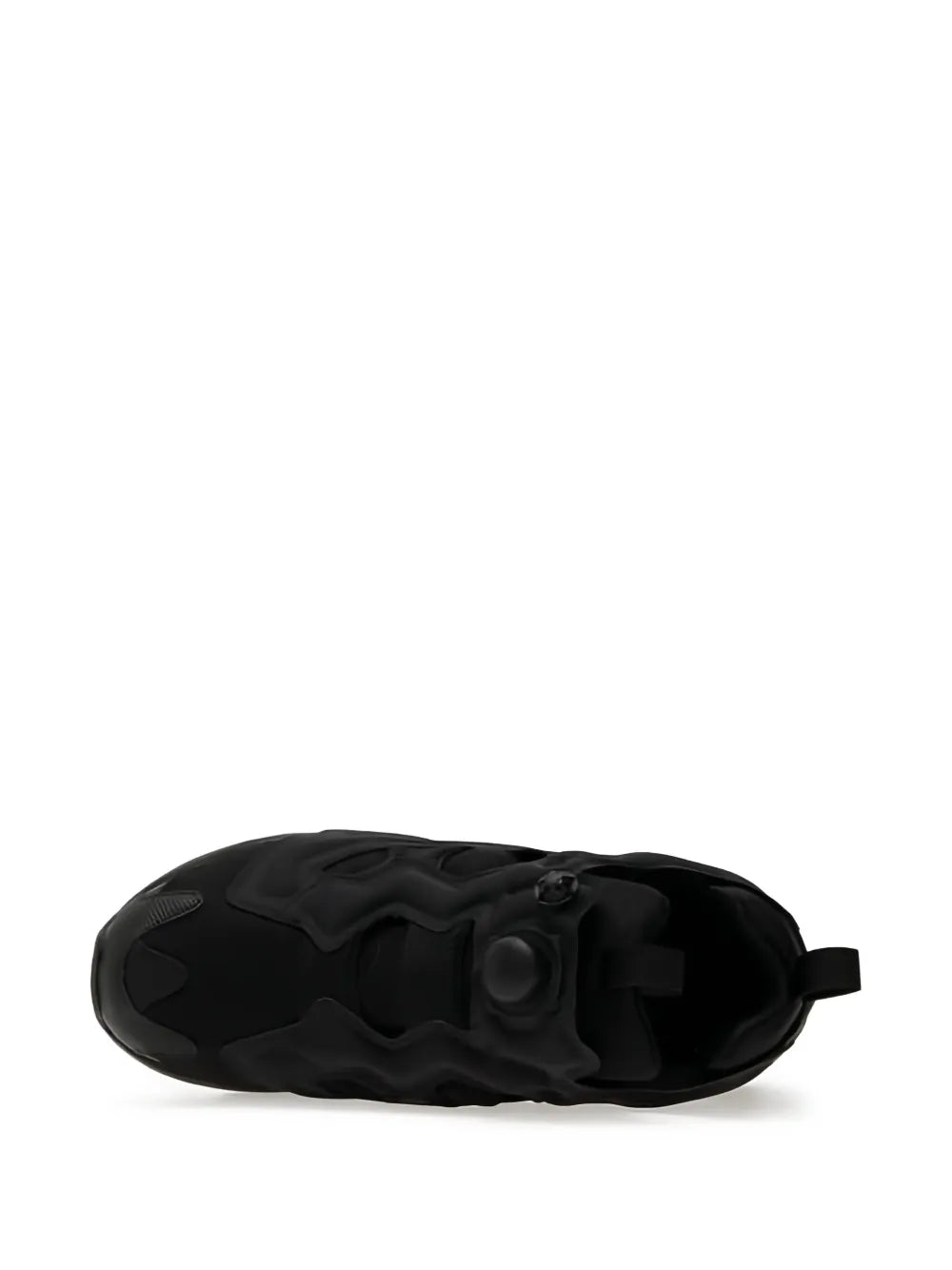 Black sneaker outsole view with tread pattern and rounded toe edge