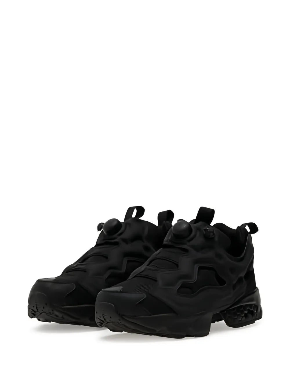 Black Reebok sneaker pair showing side profile, sculpted overlays, and thick outsole