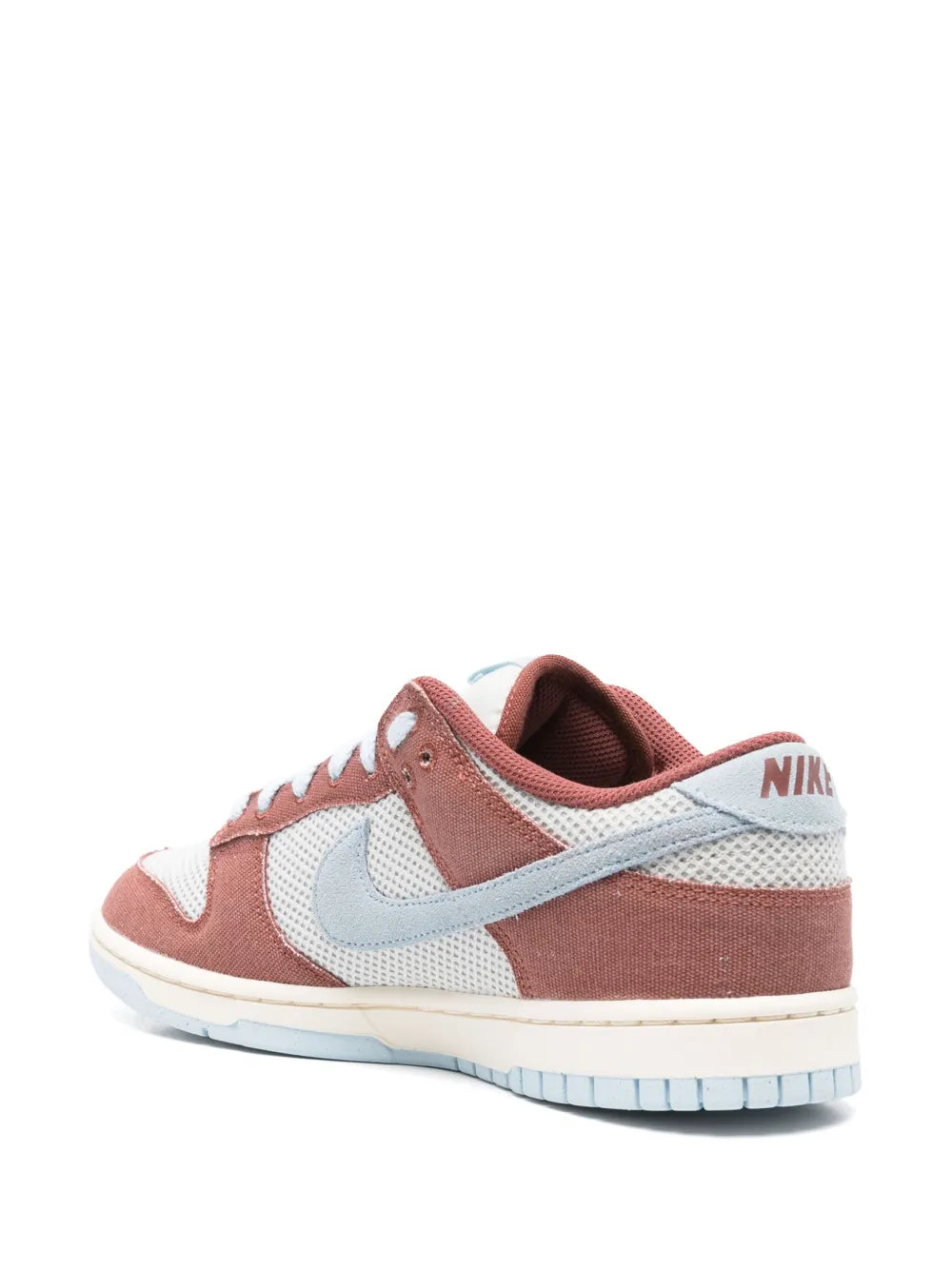 Nike Dunk Low low-top sneakers, side view; brown, white, and light blue details