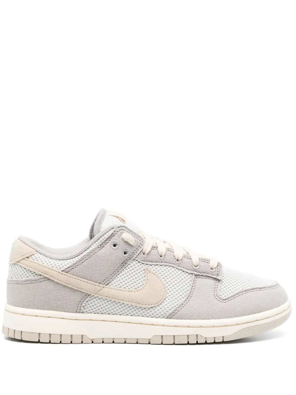 Low-top sneakers in light grey and cream, mesh panels, lace-up with Nike logo