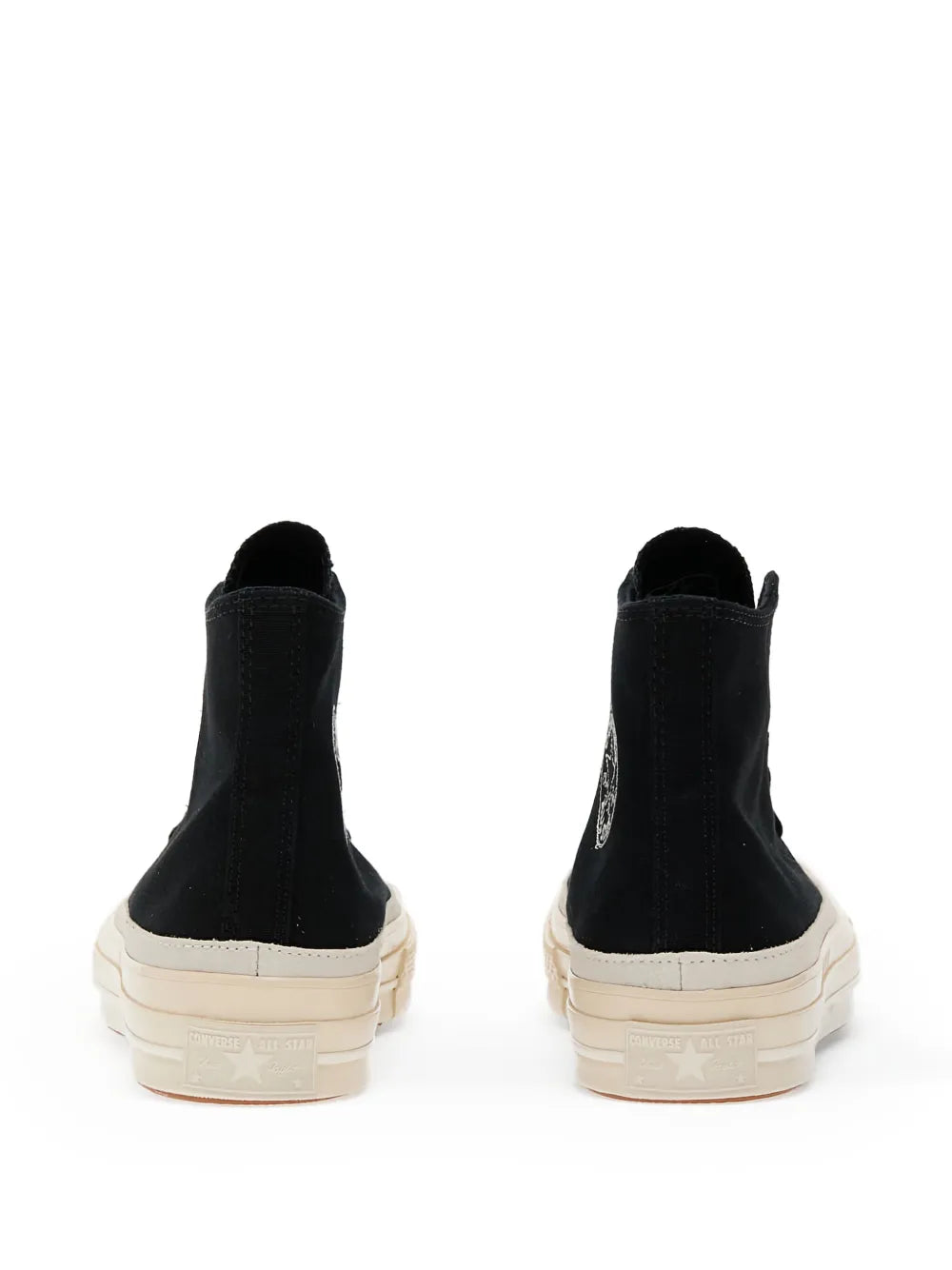 Black high-top sneaker back view with off-white heel cap and rubber sole
