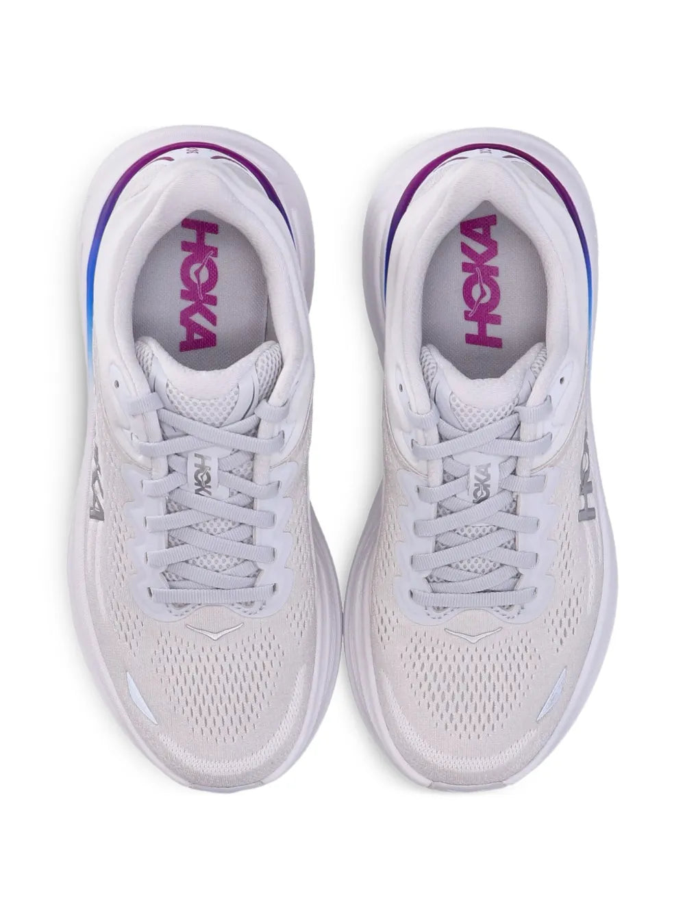 Pair of white HOKA running shoes, lace-up front view with purple HOKA branding
