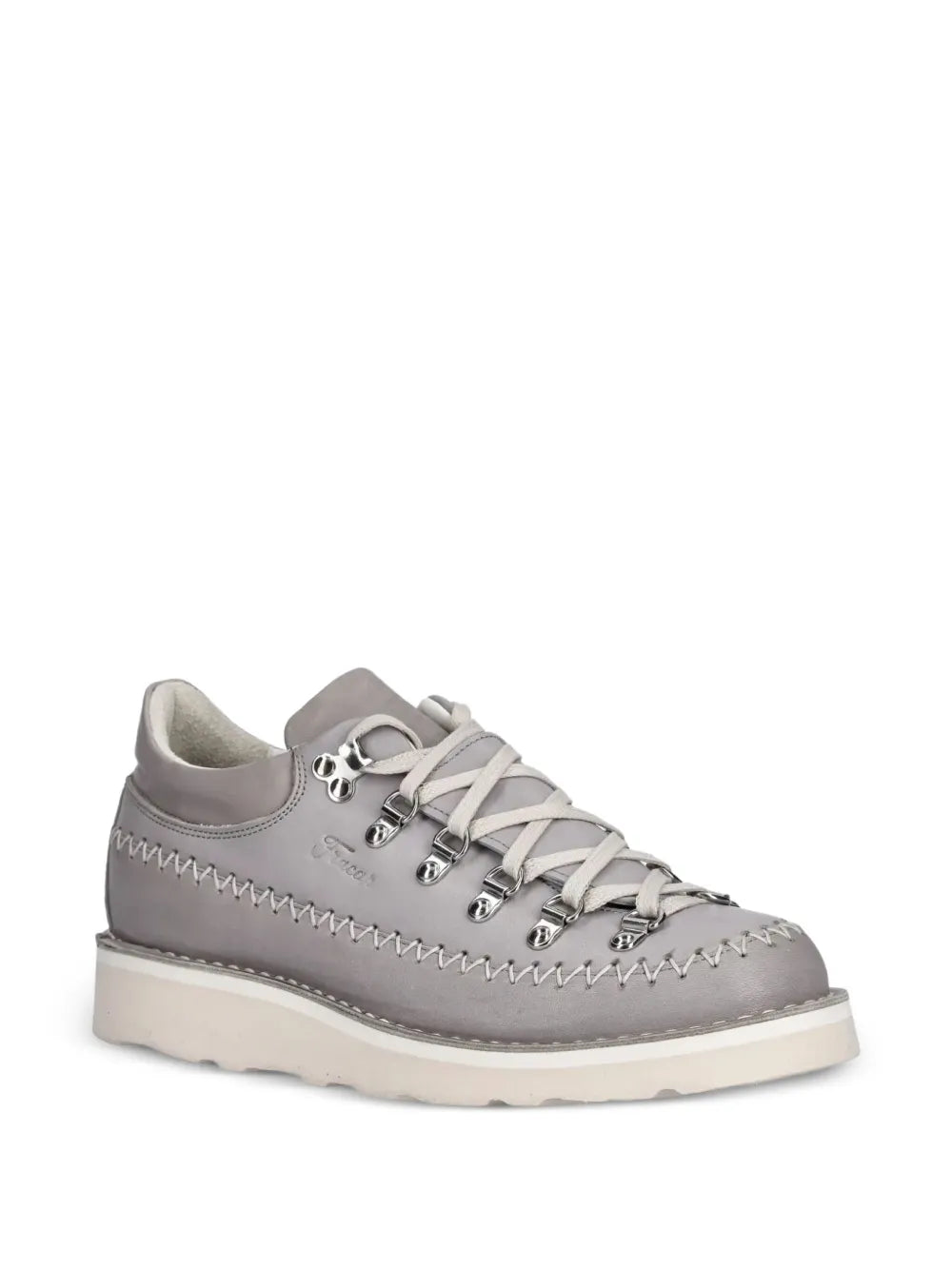 Grey lace-up sneaker, side view with metal lace eyelets and decorative contrast stitching