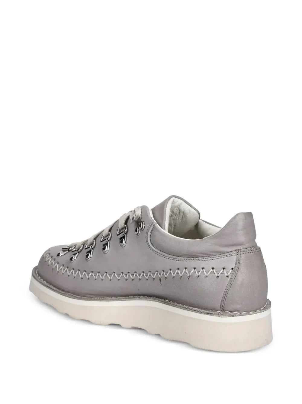 Grey lace-up sneaker, rear side view with stitched panels and light-colored sole