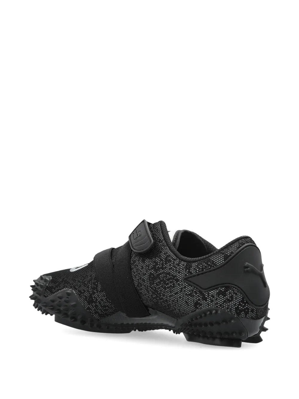 Black trail sneaker with textured upper, sculpted heel, and studded outsole